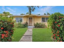 Charming single-story home with a well-maintained front yard and vibrant flowering bushes at 5631 23Rd S Ave, Gulfport, FL 33707