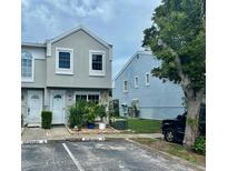 Charming townhome featuring a well-maintained exterior, reserved parking, and inviting front landscaping at 6781 121St Ave # H, Largo, FL 33773