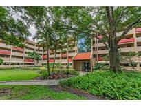 Beautiful building exterior with lush landscaping and a well-maintained facade at 3062 Eastland Blvd # 308, Clearwater, FL 33761