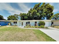 Charming single-story home featuring manicured landscaping and a freshly painted exterior at 4505 S Clark Ave, Tampa, FL 33611