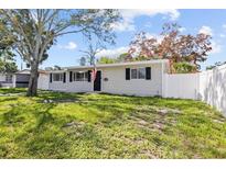 Charming single-story home with a well-maintained lawn and a freshly painted exterior at 4718 W Oklahoma Ave, Tampa, FL 33616