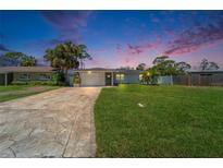 Charming single-story home with a well-manicured lawn and inviting curb appeal at 4518 Helena Ne St, St Petersburg, FL 33703