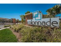 Community entrance sign featuring manicured landscaping and a clear blue sky, inviting you to Colonnade at 575 53Rd N Ave, St Petersburg, FL 33703