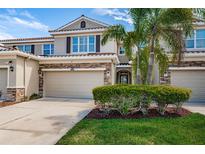 Charming two-story townhome with a well-manicured lawn, two car garage, and lovely stone accents at 575 53Rd N Ave, St Petersburg, FL 33703