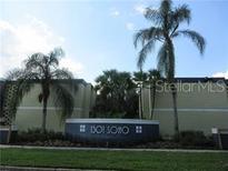 Exterior view of building entrance with mature palm trees at 1301 S Howard Ave # C4, Tampa, FL 33606