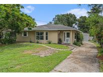 Charming single-story home with a well-maintained lawn and a welcoming front entrance at 1533 Suffolk N St, St Petersburg, FL 33710