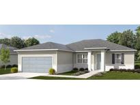 Charming single-story home with a two-car garage, well-maintained lawn and simple landscaping at 2164 Jeannin Dr, North Port, FL 34287