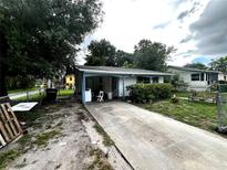 Charming single-story home featuring a covered carport and quaint curb appeal at 2625 E 28Th Ave, Tampa, FL 33605