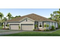 Charming single-story home featuring a two-car garage, well-manicured lawn, and tastefully landscaped front yard at 31451 Paper Birch St, Wesley Chapel, FL 33545