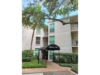 Exterior of a white building with the name Bayshore Trace over the entrance and well-manicured landscaping at 3325 Bayshore Blvd # C14, Tampa, FL 33629