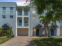 Charming townhome featuring a private garage and quaint balconies, perfect for enjoying Florida's sunshine at 4503 Legacy Park Dr, Tampa, FL 33611