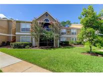 Charming two-story condo featuring a well-maintained lawn and delightful trees at 9481 Highland Oak Dr # 1308, Tampa, FL 33647