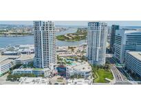 Stunning aerial view of waterfront towers and resort-style pool with city and water views at 1209 E Cumberland Ave # 2703, Tampa, FL 33602
