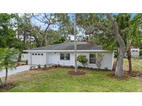 Charming single-story home with fresh paint, landscaped yard, and attached garage at 1826 2Nd E Ave, Bradenton, FL 34208