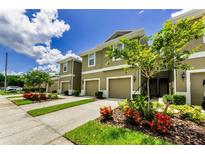 Inviting townhomes featuring well-maintained landscaping, covered entries, and attached one-car garages at 2119 Broadway View Ave, Brandon, FL 33510