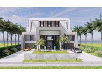 Stunning modern home with clean lines, lush landscaping, and private driveway for ultimate curb appeal at 3611 Bayshore Ne Blvd, St Petersburg, FL 33703
