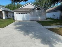Charming single-story home with a well-maintained front yard and a two-car garage at 513 Summer Sails Dr, Valrico, FL 33594