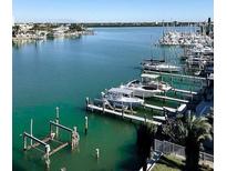 Scenic waterfront view of boats docked along the bay, showcasing beautiful waterfront living at 706 Bayway Blvd # 502, Clearwater Beach, FL 33767