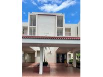 A well-maintained, multi-story building featuring architectural design and a welcoming covered entrance at 7893 Sailboat Key S Blvd # 304, South Pasadena, FL 33707