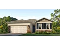 Charming single-Gathering home featuring stone accents, a two-car garage, and a well-manicured lawn at 8023 Sail Clover Ln, Zephyrhills, FL 33540