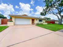 Charming single Gathering home with tile roof, two car garage and mature landscaping at 9951 121St St, Seminole, FL 33772