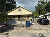 Charming single-story home with covered front porch and driveway parking at 2909 N 11Th St, Tampa, FL 33605