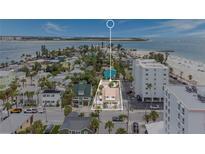 Beautiful aerial view of coastal property with sandy beaches and ocean views in a lovely neighborhood at 108 5Th Ave, St Pete Beach, FL 33706
