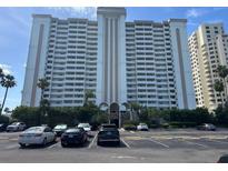 An exterior shot of this lovely highrise building with parking in front at 1230 Gulf Blvd # 601, Clearwater Beach, FL 33767