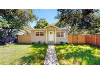 Charming single-story home featuring a well-maintained lawn and a walkway leading to the front door at 1924 48Th S St, St Petersburg, FL 33711