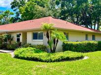 Inviting single-story home with mature landscaping and a red roof for a charming curb appeal at 2460 Northside Dr # 708, Clearwater, FL 33761