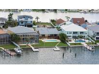 Waterfront homes feature docks, pools, and lush landscaping in this desirable coastal community at 17025 Dolphin Dr, North Redington Beach, FL 33708