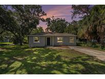 Charming single-story home featuring a well-manicured lawn and mature trees, offering great curb appeal at 3205 68Th N Ave, St Petersburg, FL 33702