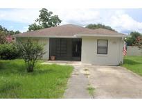 Charming single-story home with a well-maintained lawn and neutral-colored exterior at 38668 Ferm Cir, Zephyrhills, FL 33540