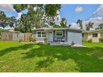 Charming single-story home featuring a well-maintained lawn and a cozy front porch at 5840 39Th N St, St Petersburg, FL 33714
