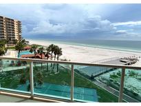 Beautiful beach view from the balcony of this condo with pool, shuffleboard court, and pier at 880 Mandalay Ave # N311, Clearwater Beach, FL 33767