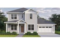 Charming two-story home featuring a light gray exterior, attached garage, and professionally landscaped front yard at 0 4Oth N Ave, St Petersburg, FL 33703
