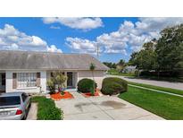 Charming single-story home with a well-maintained front yard and a cozy, inviting entrance at 2937 Stilwell Ct, New Port Richey, FL 34655