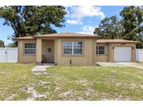 Charming single-story home featuring a neutral color scheme and attached one car garage at 525 38Th S St, St Petersburg, FL 33711