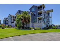 Well-maintained condo building boasts lush landscaping and ample parking at 5722 Biscayne Ct # 107, New Port Richey, FL 34652
