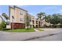 Inviting exterior of the home features lush landscaping, manicured lawns, and a well-maintained facade at 6 Academy S Way # 221, St Petersburg, FL 33711