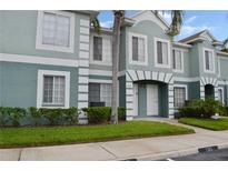 Inviting condo featuring a charming exterior with well-maintained landscaping, set under a clear blue sky at 1302 Twilridge Pl, Brandon, FL 33511