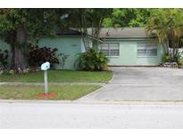 Charming single story home with mature trees and a well maintained lawn in a quiet neighborhood at 2058 Dodge St, Clearwater, FL 33760