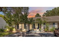 Charming home exterior featuring lush landscaping and inviting curb appeal at 1136 Thayer St, Safety Harbor, FL 34695