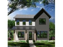 Charming two-story home with a modern farmhouse design, front porch, gray brick, and black trim windows at 2828 13Th N St, St Petersburg, FL 33704