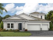 Charming single-Gathering home featuring a three-car garage, manicured lawn, and a stylish architectural design at 10243 Longmeadow Ave, Parrish, FL 34219