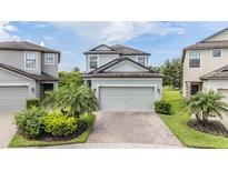 Charming two-story home with brick driveway and well-maintained landscaping at 1634 Acadia Harbor Pl, Brandon, FL 33511
