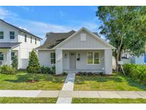 Charming craftsman-style home with gray exterior, manicured lawn, and inviting front porch at 5124 3Rd N Ave, St Petersburg, FL 33710