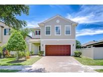 Charming two-story home boasts a brick driveway and a well-maintained landscaped yard at 828 Terra Vista St, Brandon, FL 33511