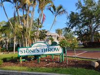 Inviting condominium complex sign surrounded by lush landscaping, offering a glimpse of the charming community at 6932 Stones Throw N Cir # 7101, St Petersburg, FL 33710