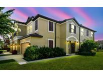 Charming two-story home with a well-manicured lawn and lush landscaping, perfect for a Gathering at 11519 Crowned Sparrow Ln, Tampa, FL 33626